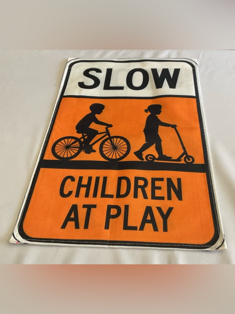 Orange and White Slow - Children at Play' Garden Flag